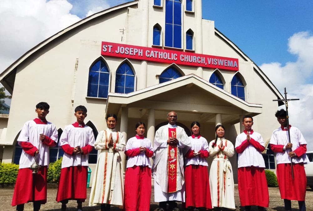 Rev Fr C Joseph along with altar servers outside St Joseph Catholic Church, Viswema, during the observation of Girl Child Day on September 8.